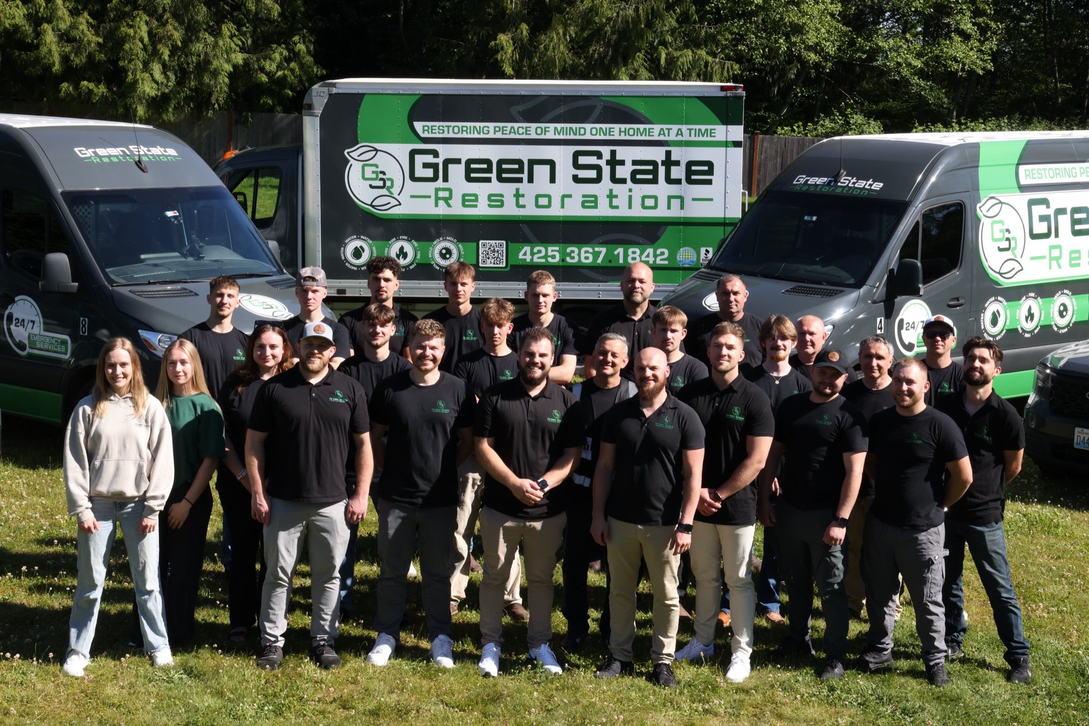 Green State Restoration team and branded emergency restoration fleet